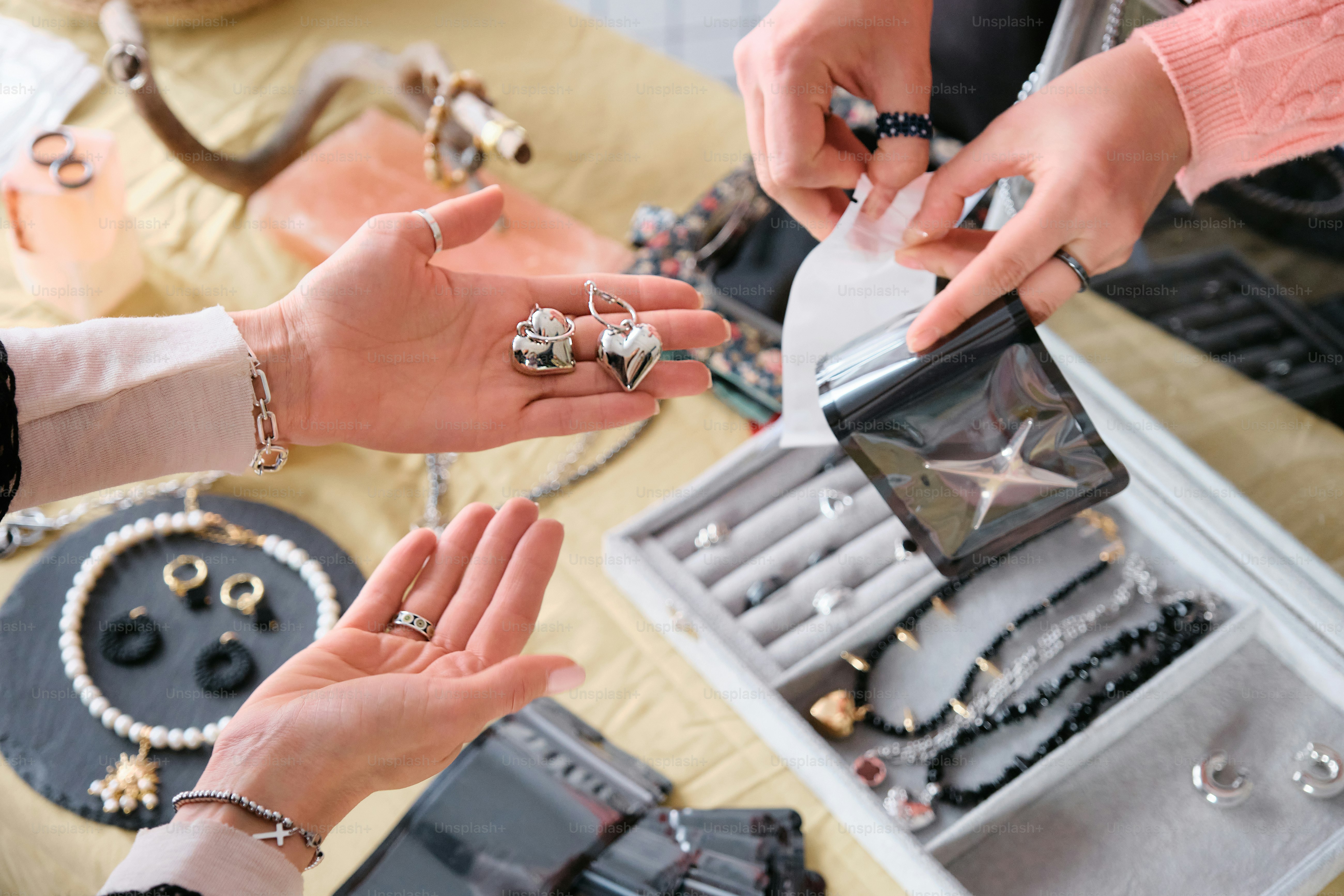 a group of people putting rings on a table