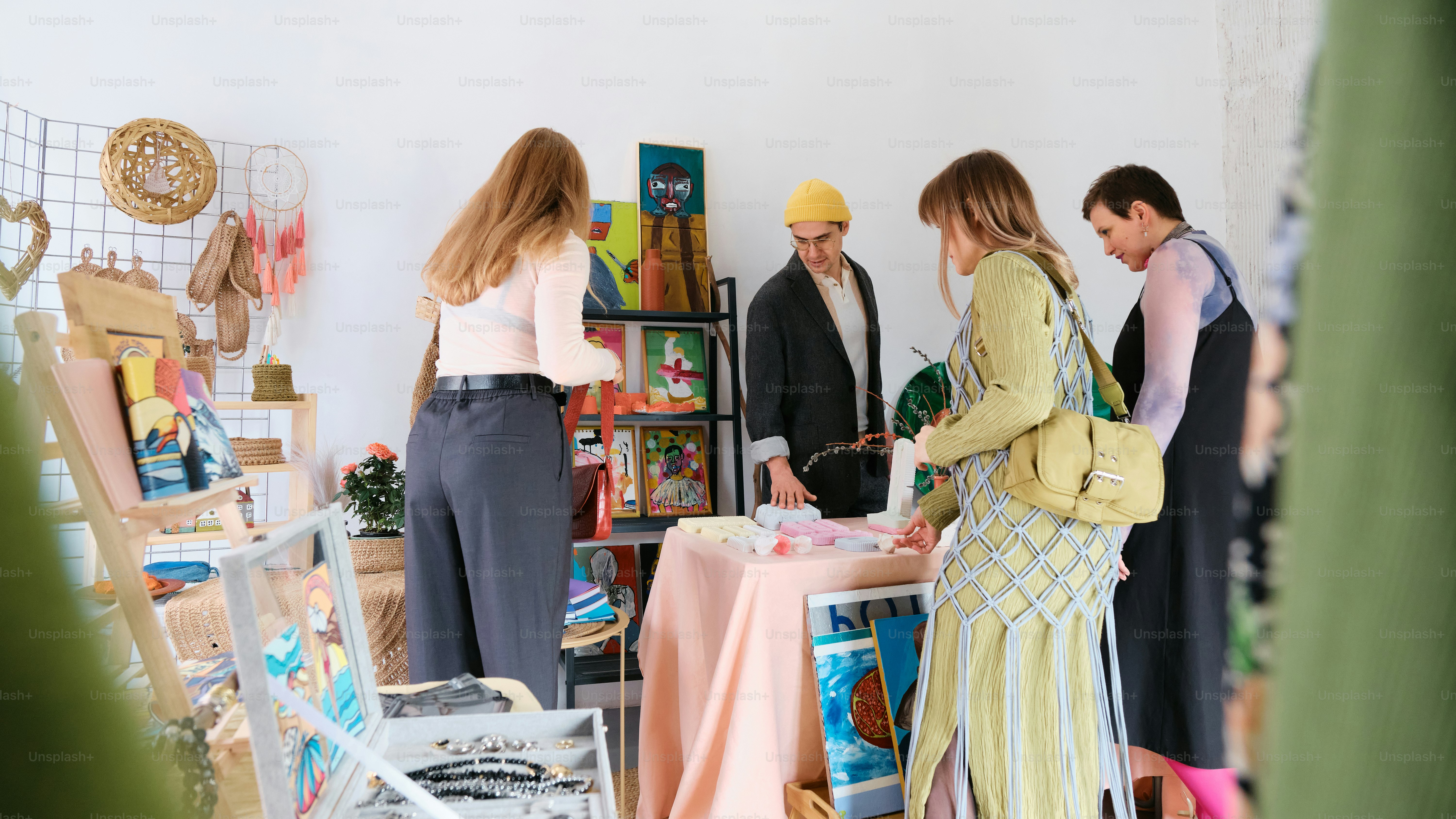 a group of people standing around a table