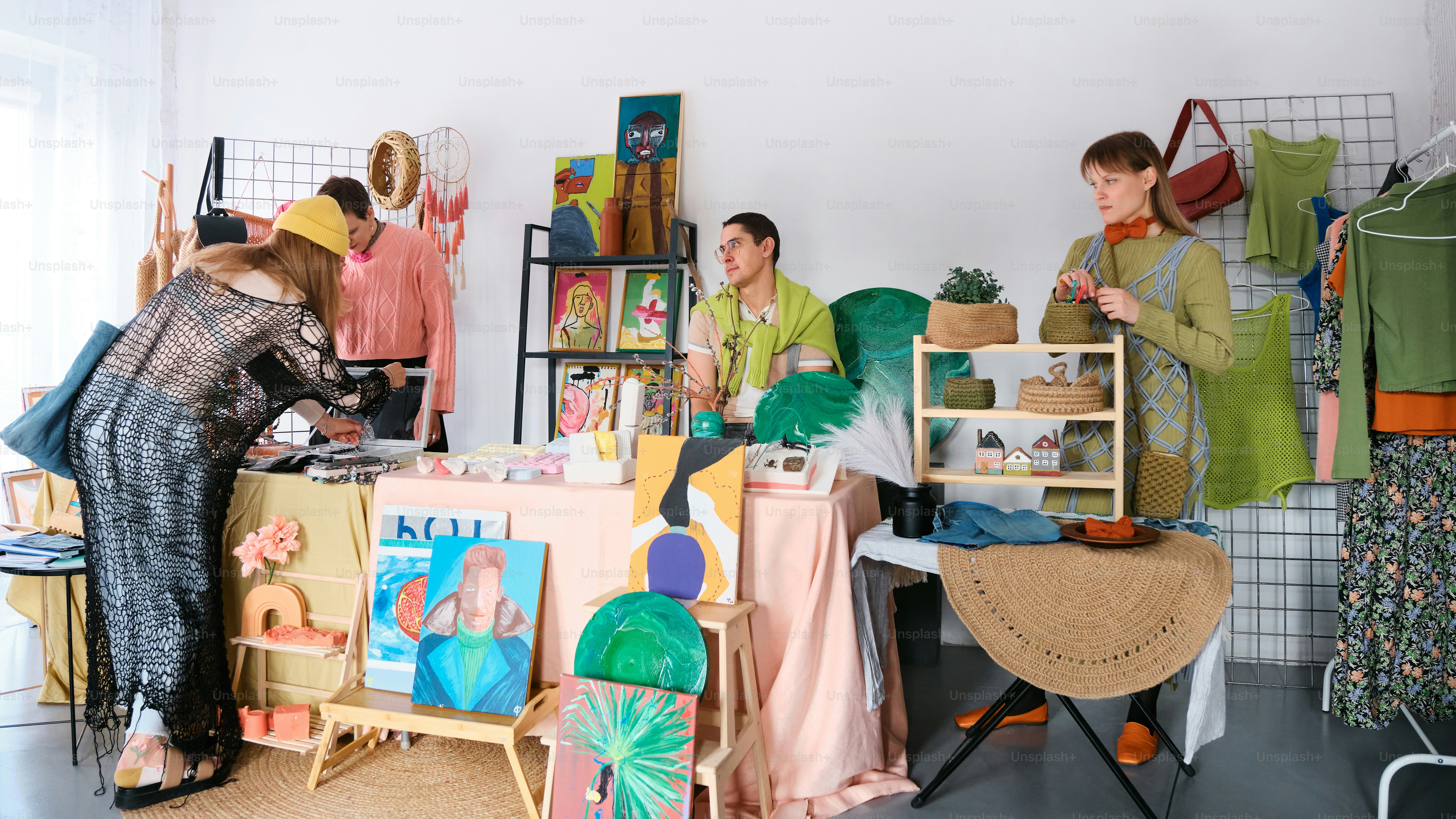 a group of people standing around a table