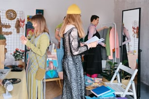 a group of women standing around a room
