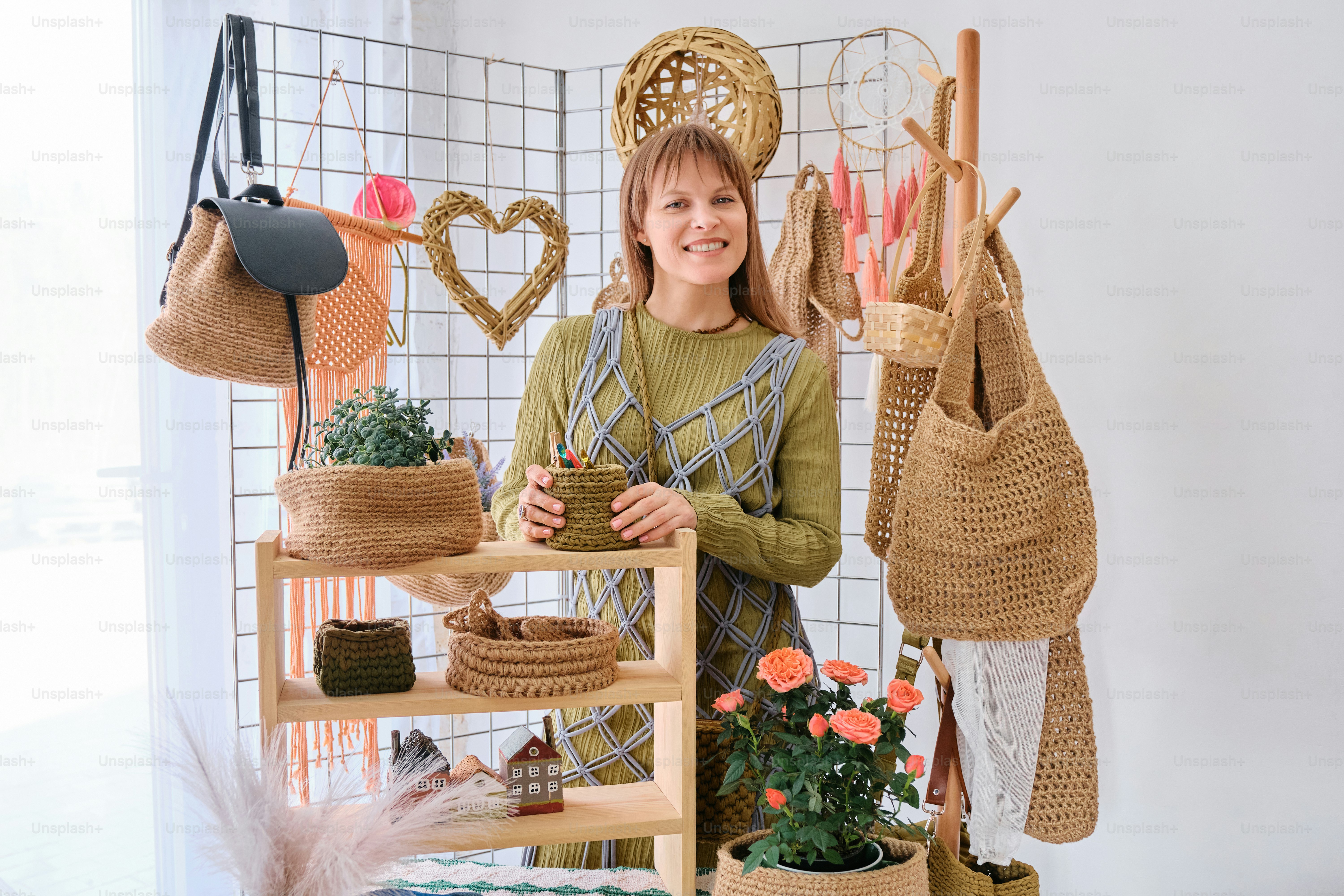 A woman standing in front of a display of baskets photo – Market Image ...