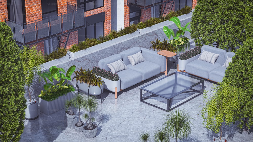 an aerial view of a patio with couches and potted plants