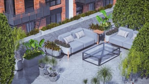 an aerial view of a patio with couches and potted plants