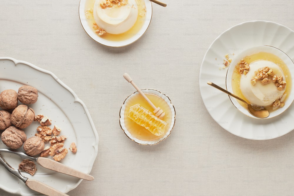 a table topped with plates of food and dessert