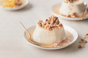 a dessert with nuts on top of it on a plate