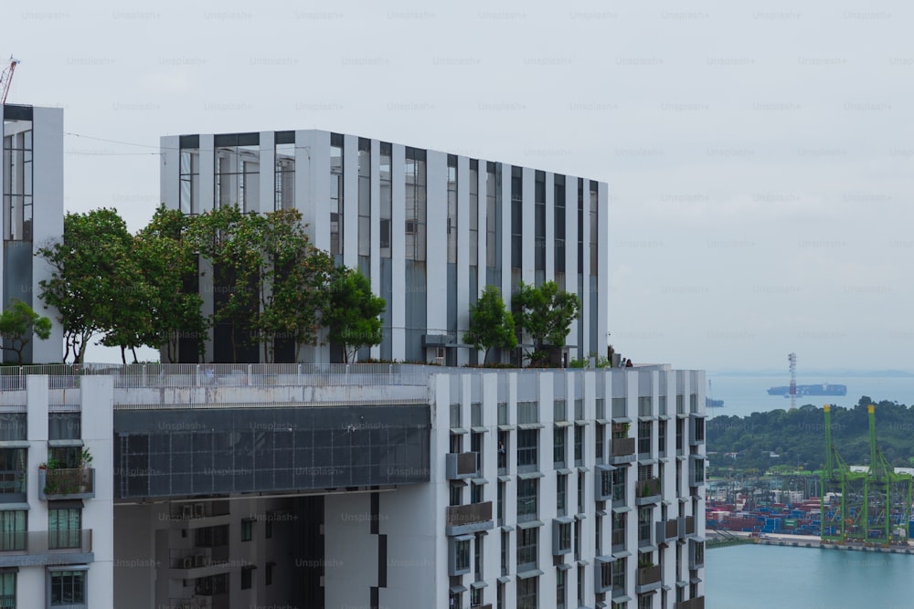 a tall building with trees on top of it