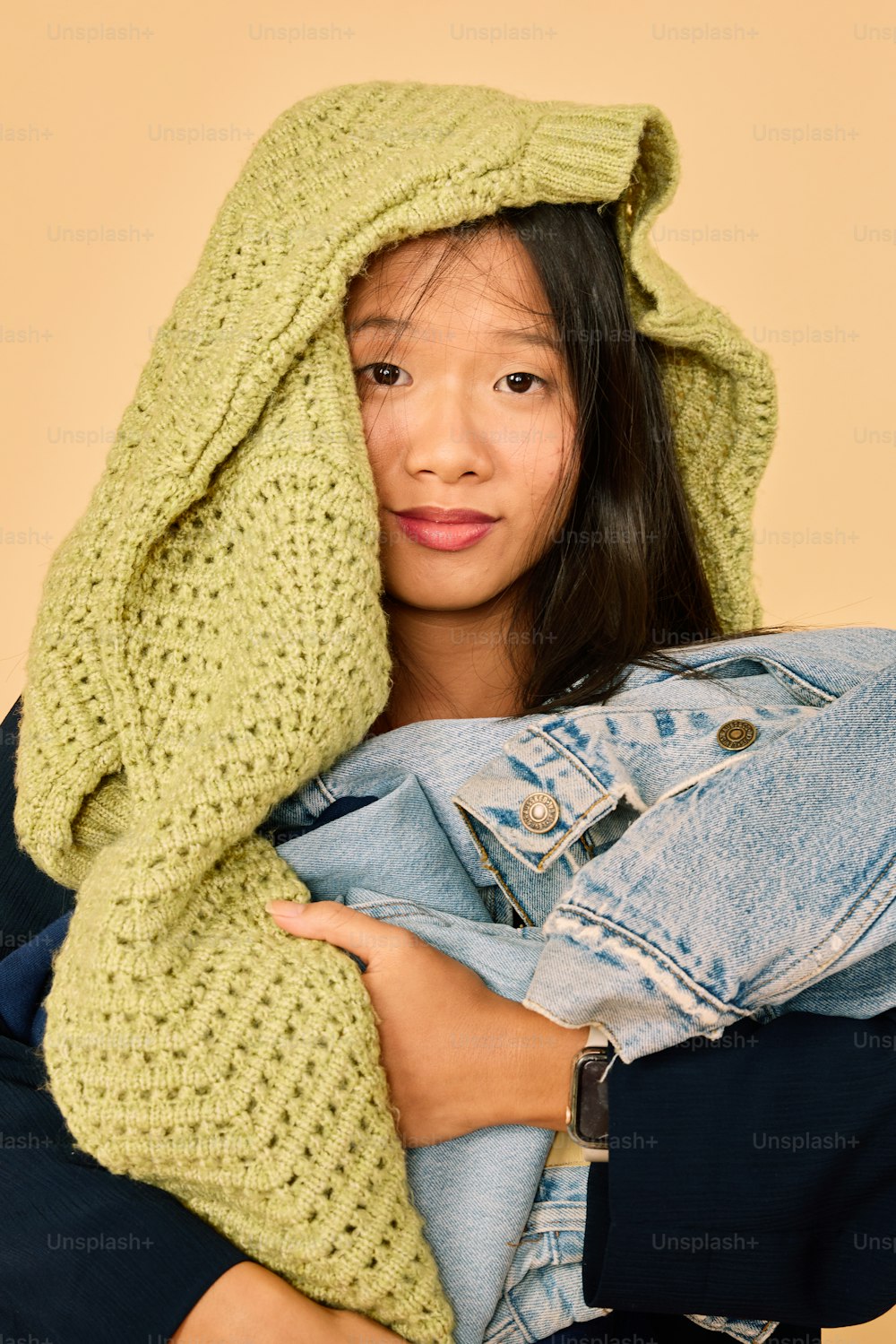 a young girl is wrapped in a blanket