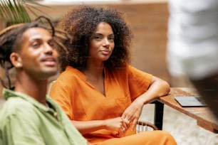 a man and a woman sitting next to each other