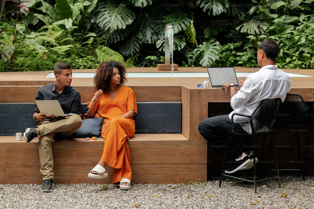 a man and a woman sitting on a bench