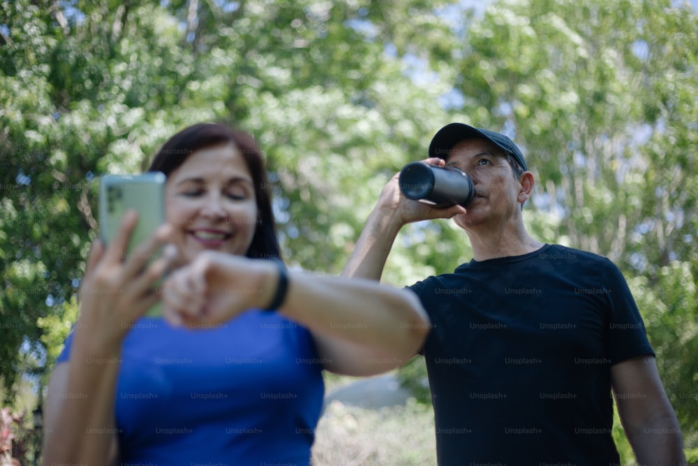 a woman taking a picture of a man with a camera