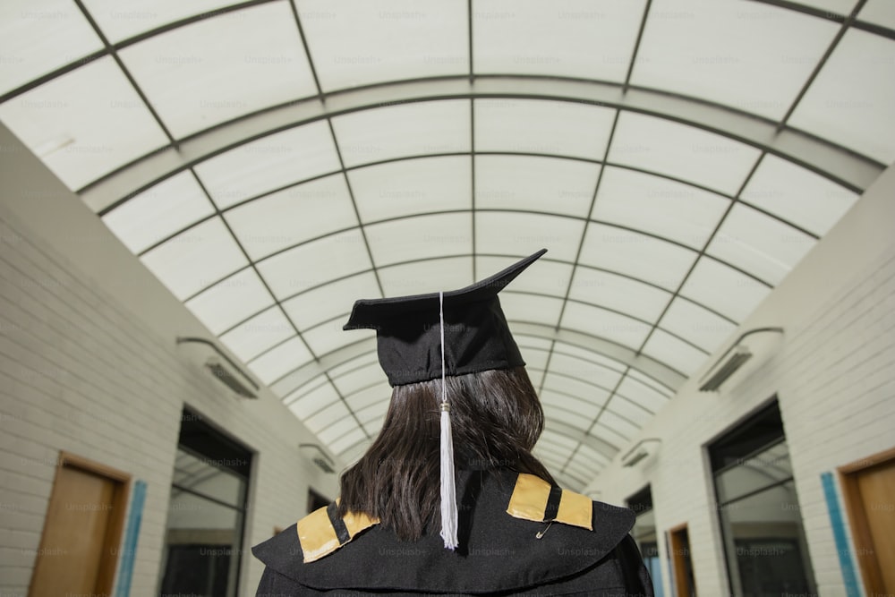 a woman in a graduation cap and gown
