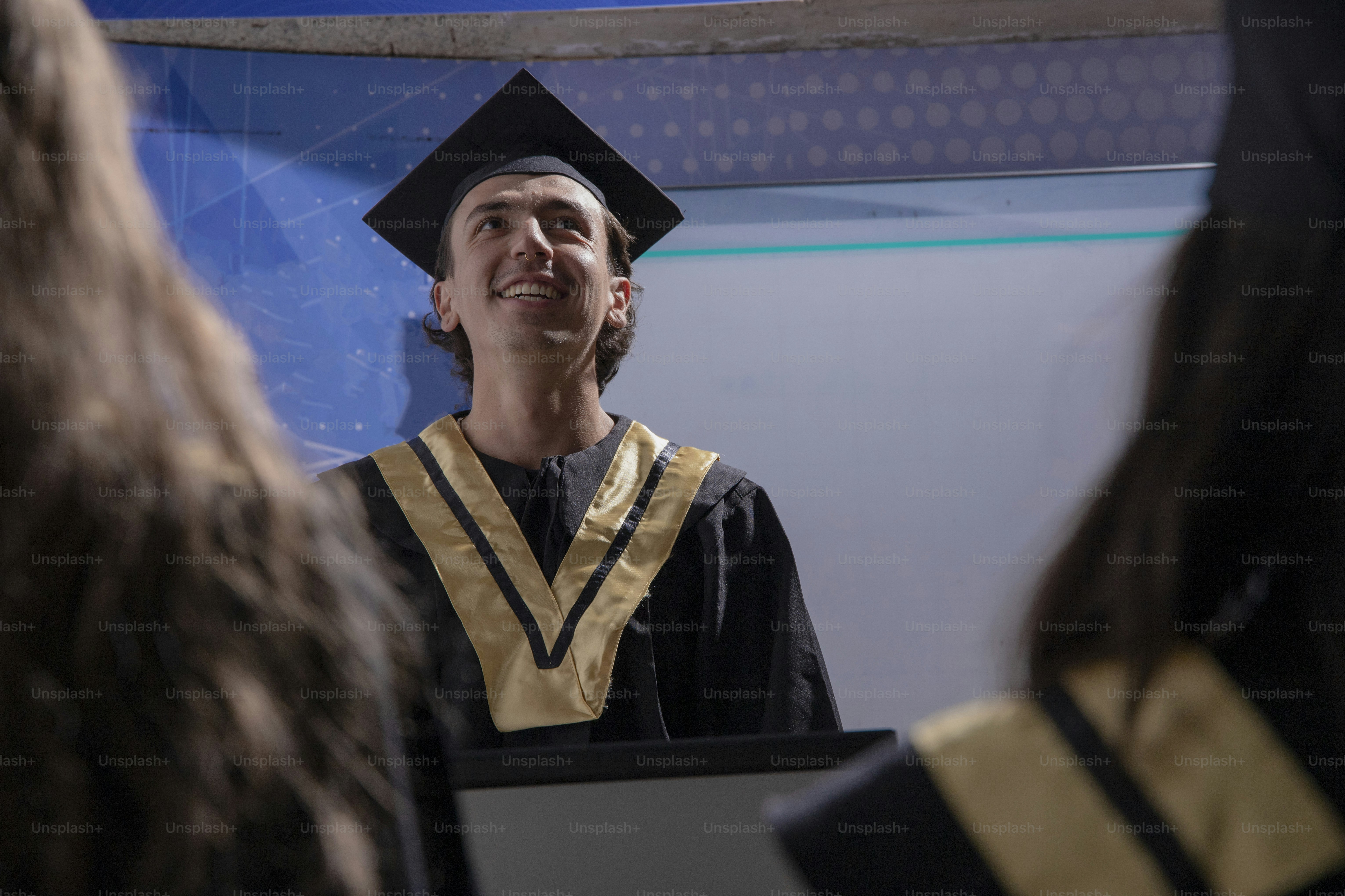 a man in a graduation cap and gown