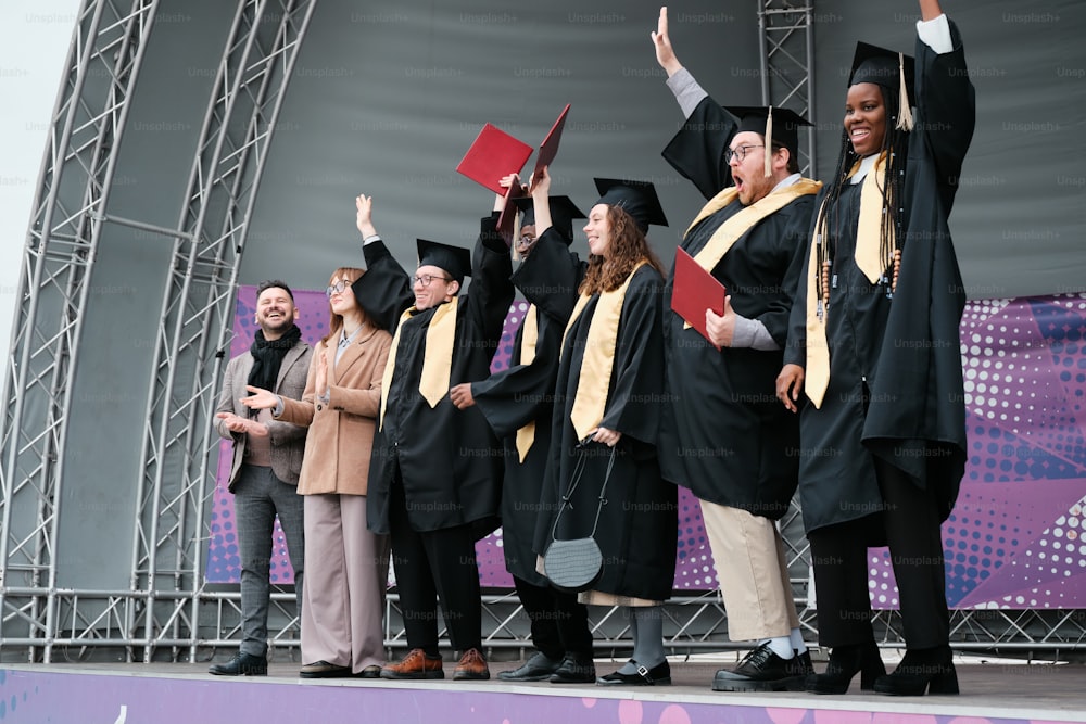 a group of people standing on top of a stage