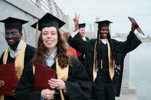 a group of graduates standing next to each other