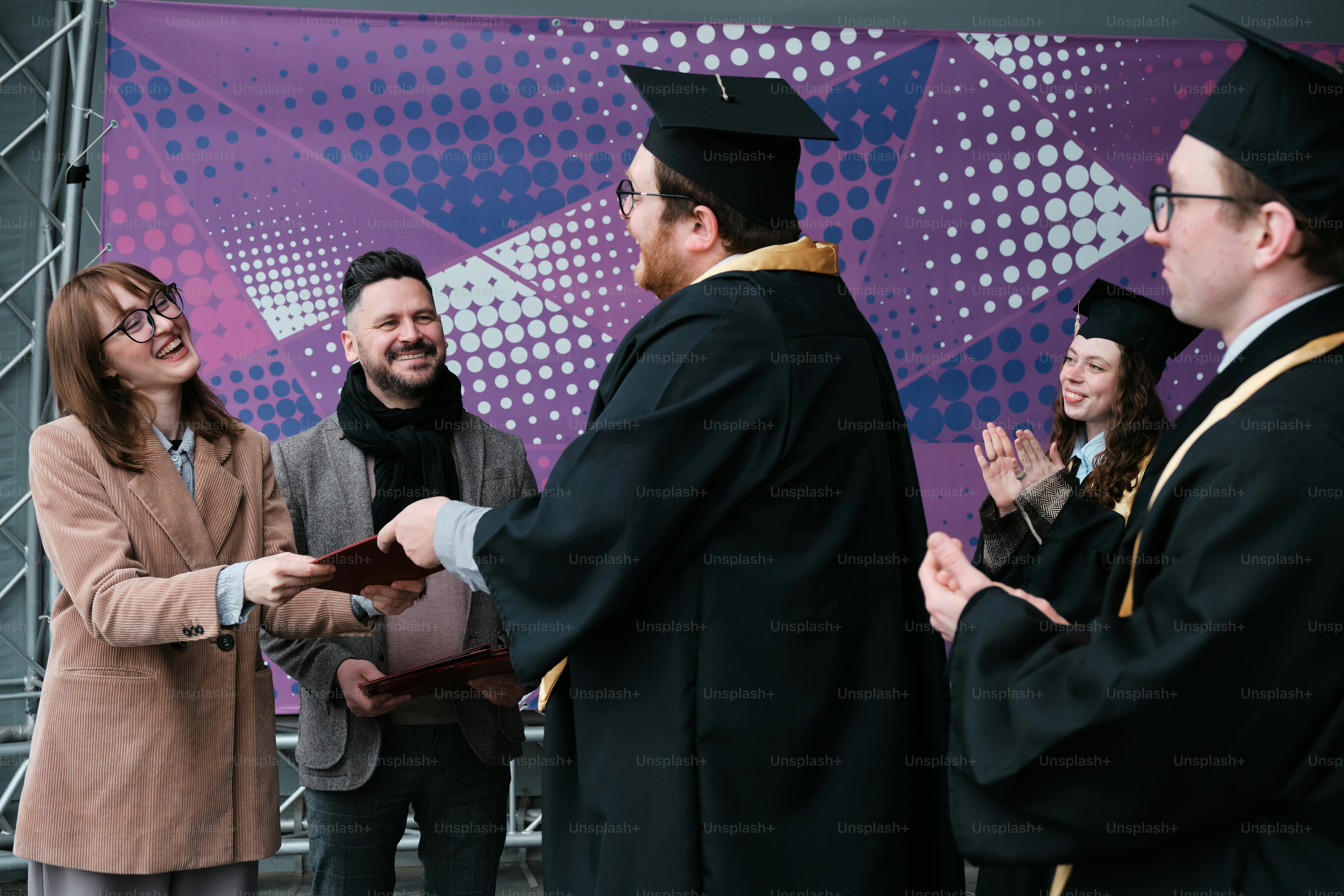 Student receiving his diploma