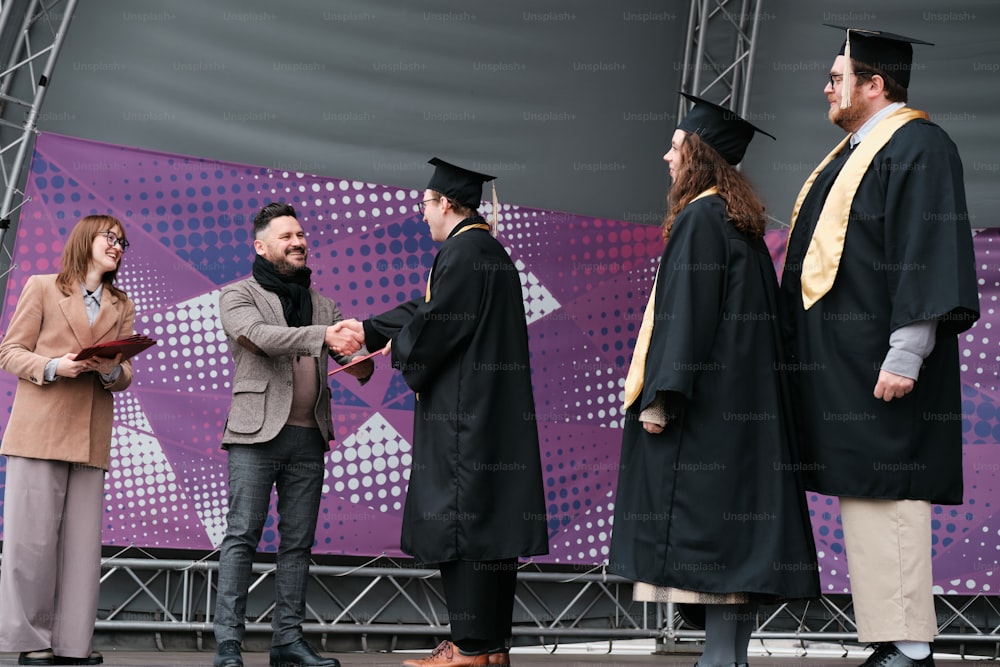 a group of people standing on top of a stage