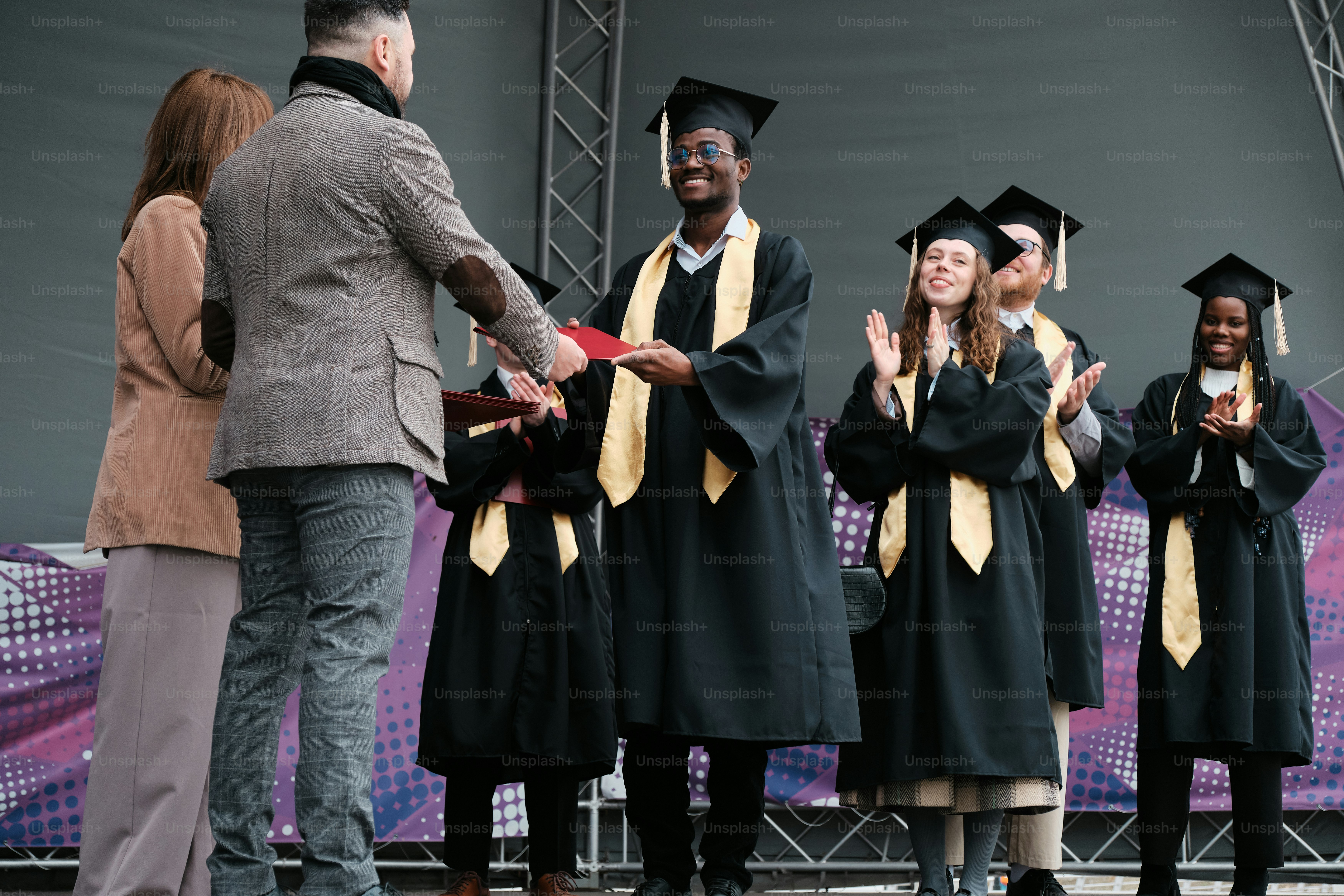 Student receiving his diploma
