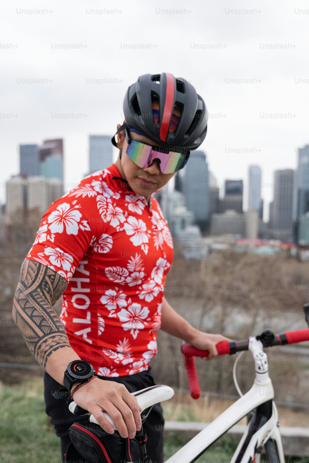 a man in a red shirt with a bicycle