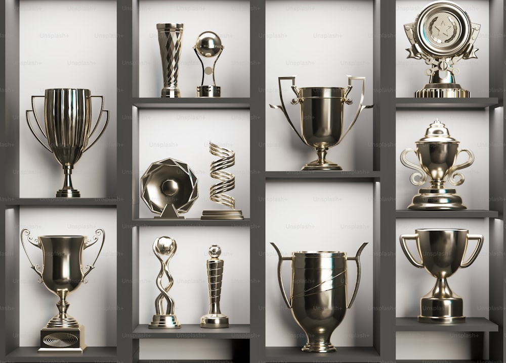 a collection of silver trophies sitting on top of a shelf