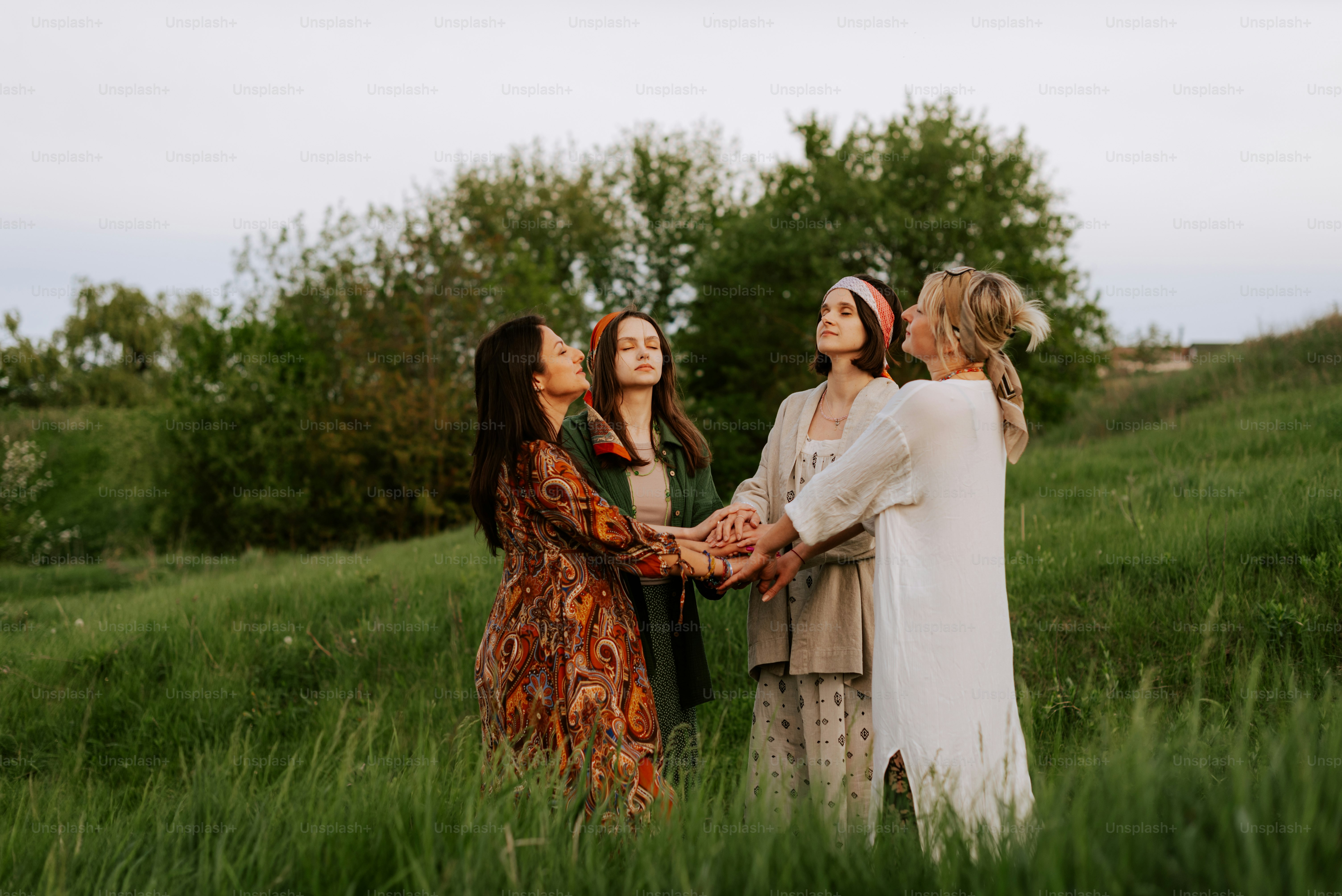 A group of women standing next to each other in a field photo – Retreat ...