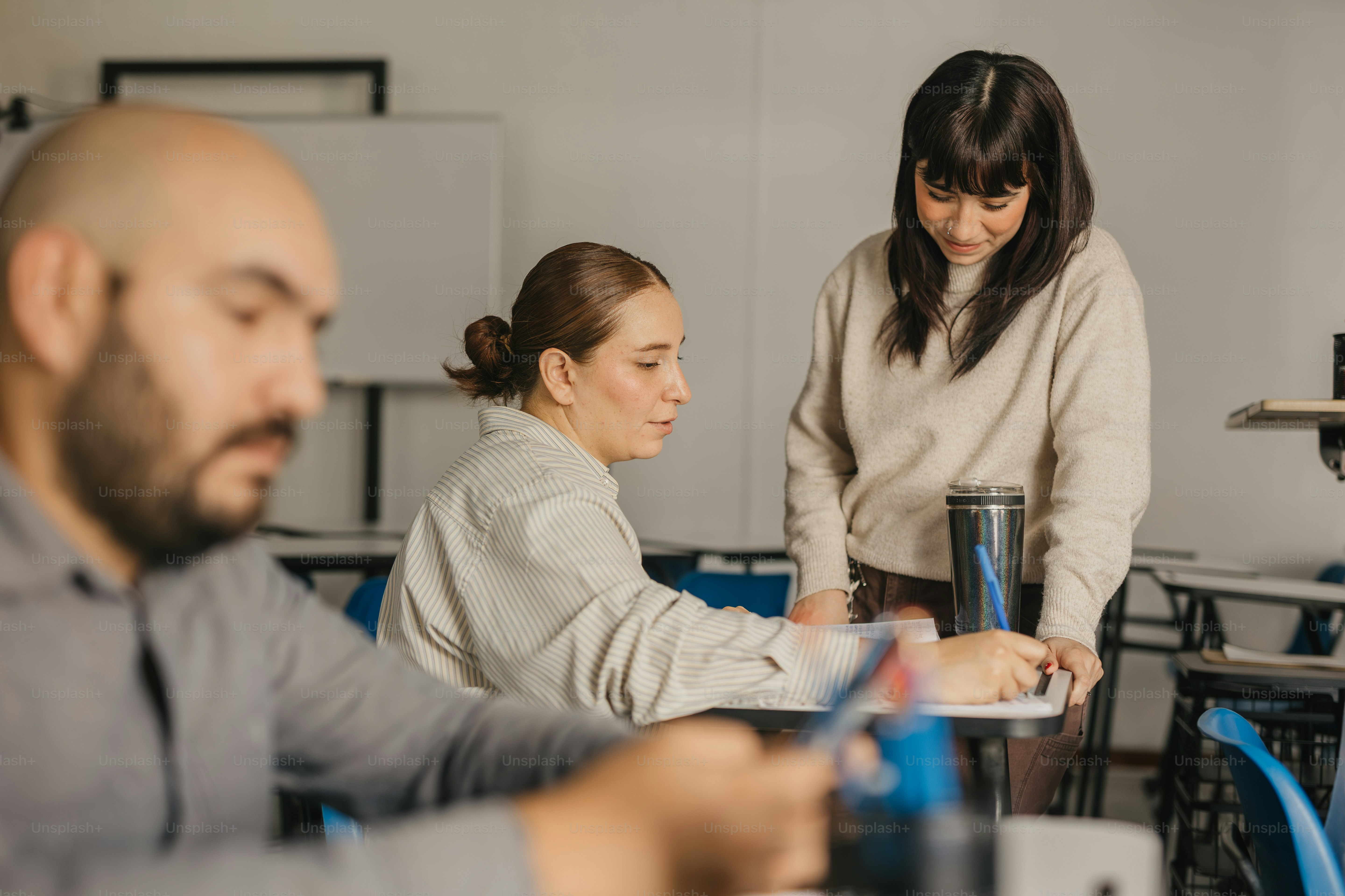 a group of people sitting around a table