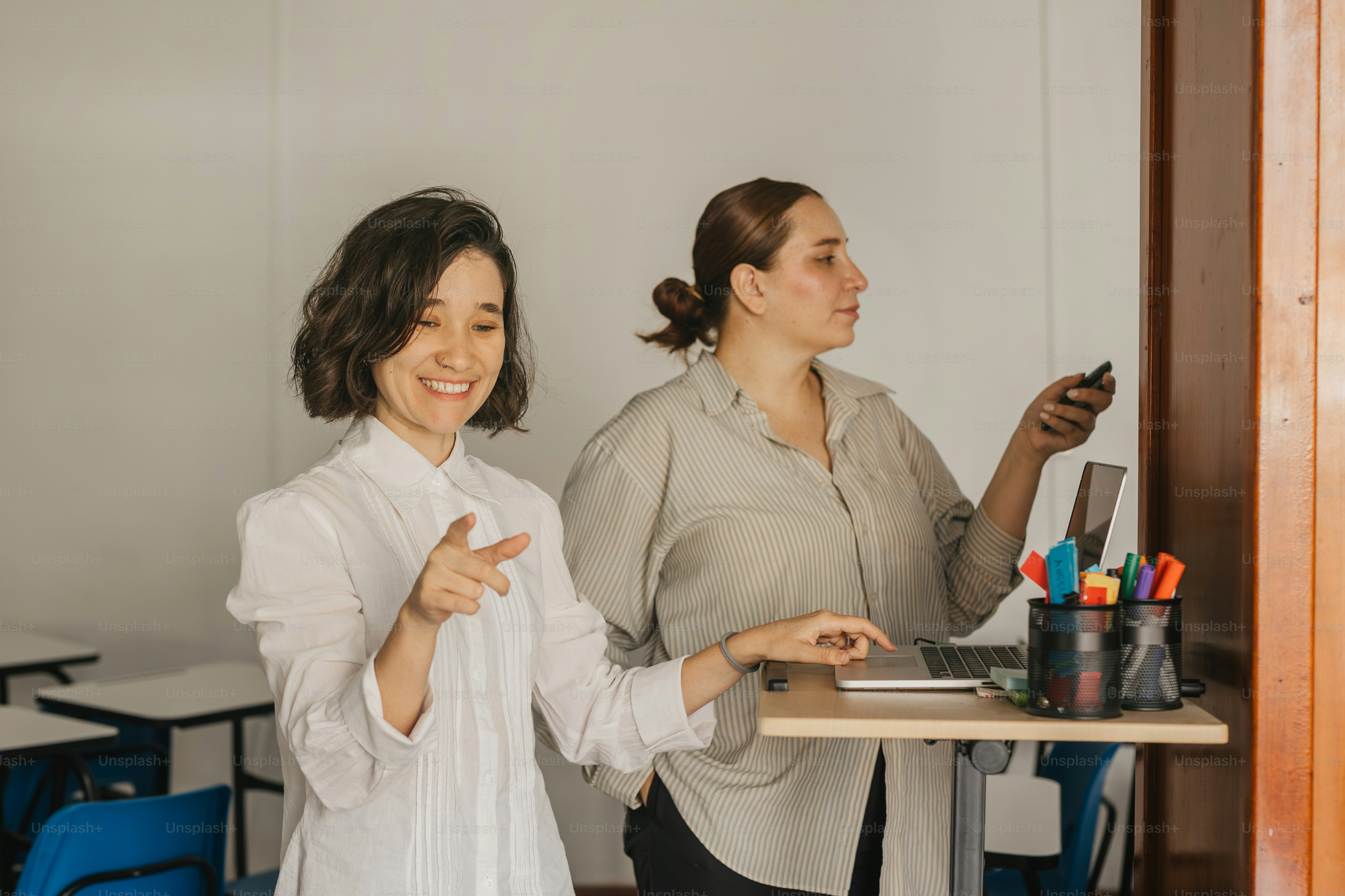 a couple of women standing next to each other