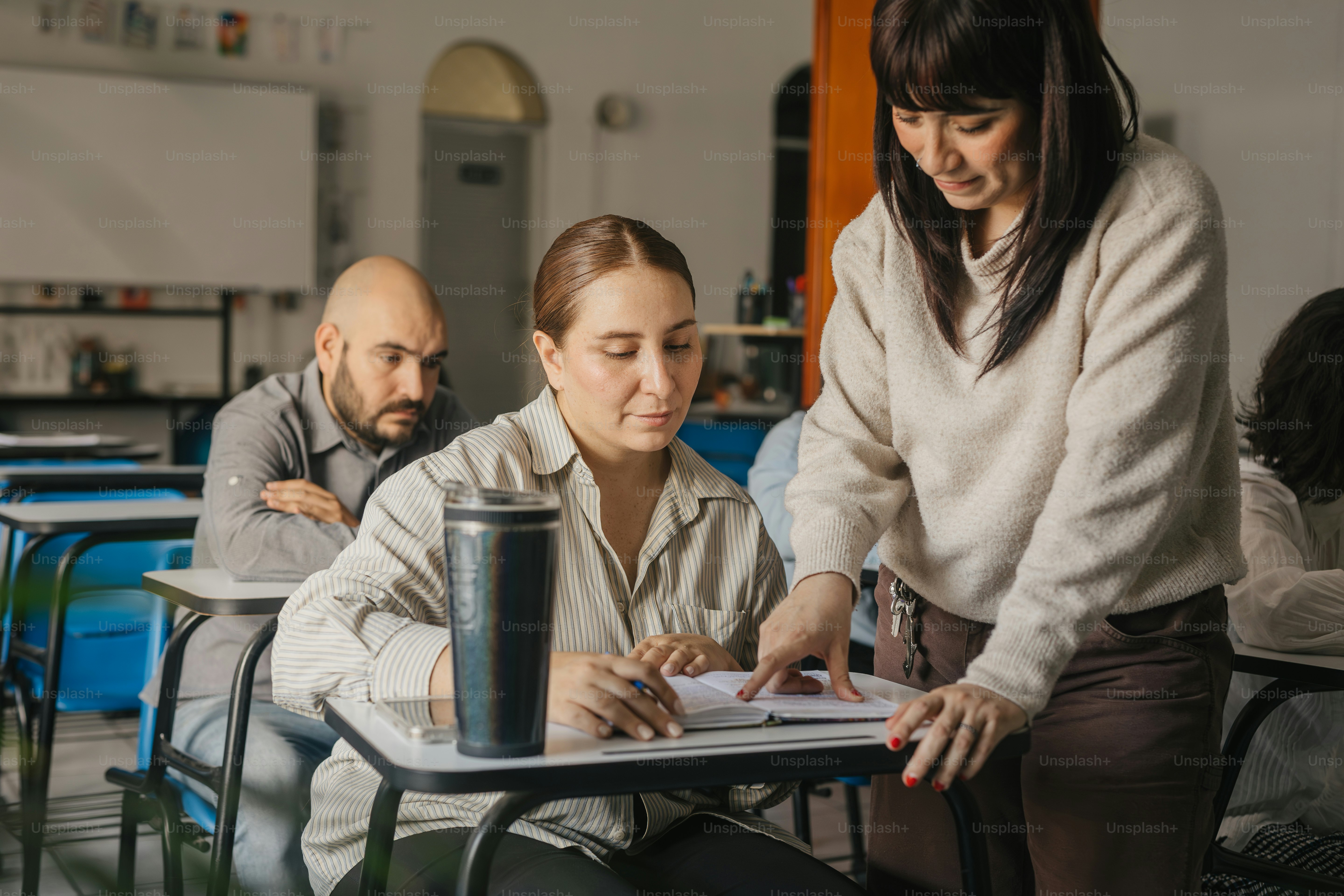 a woman sitting at a table in front of a man