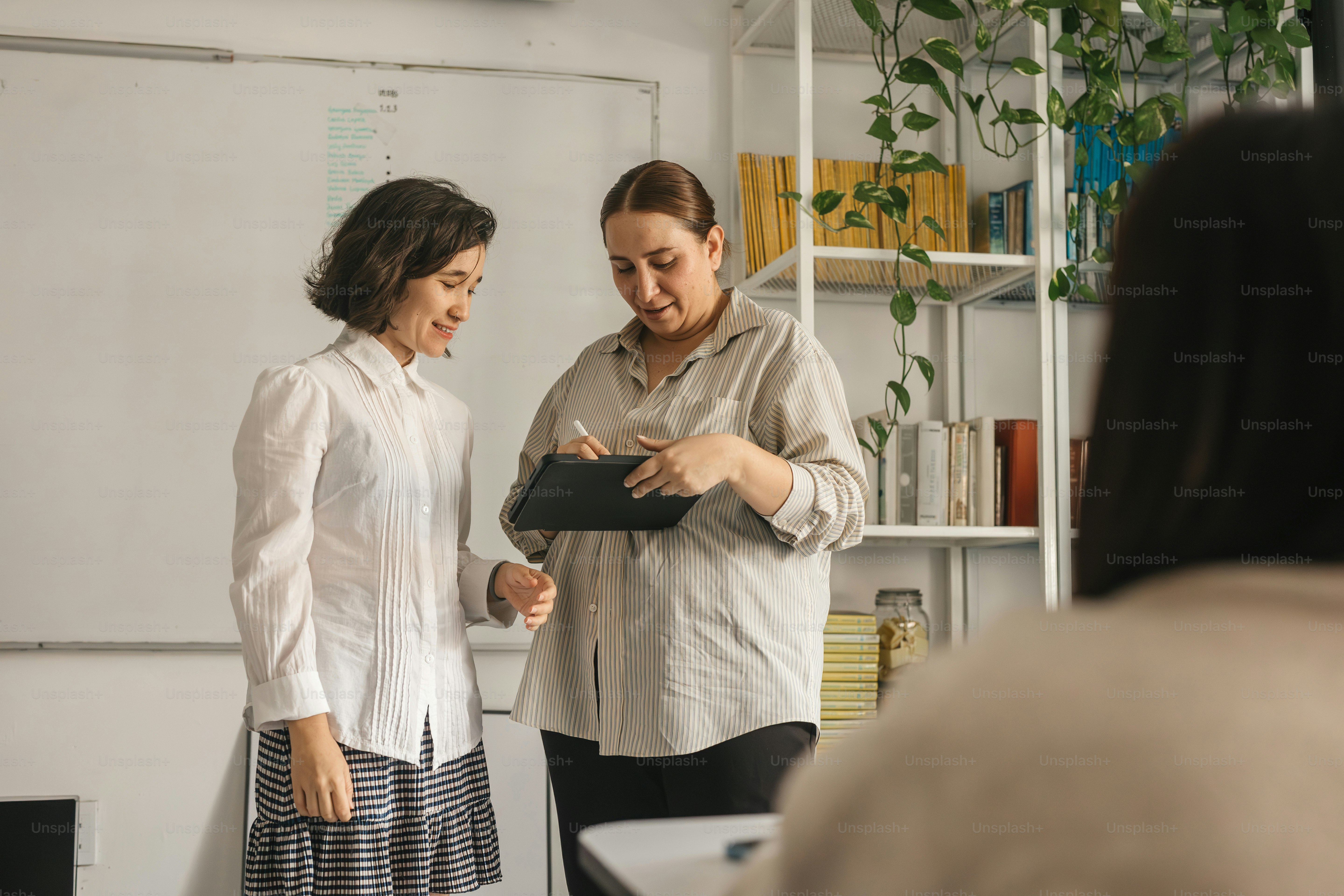 a woman standing next to a man in a room