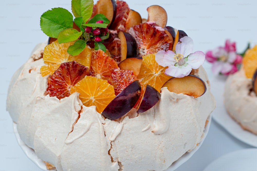 a cake with fruit on top of it on a plate