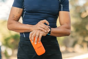a close up of a person holding a water bottle