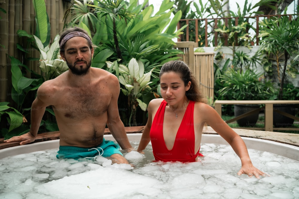 a man and a woman in a hot tub