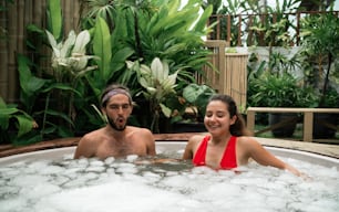 a man and a woman in a hot tub