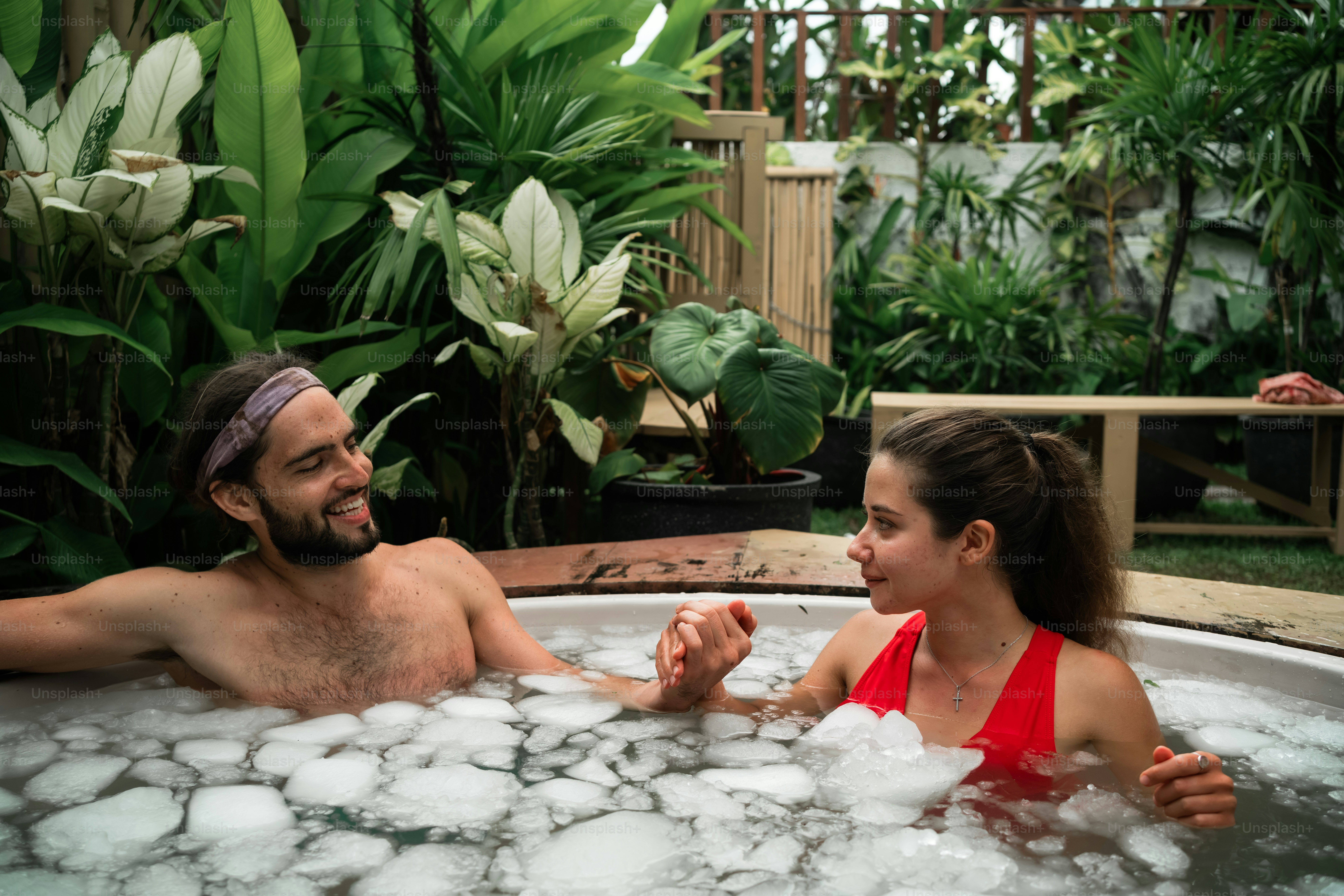 a man and a woman in a hot tub