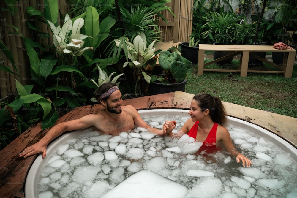 a man and a woman in a hot tub