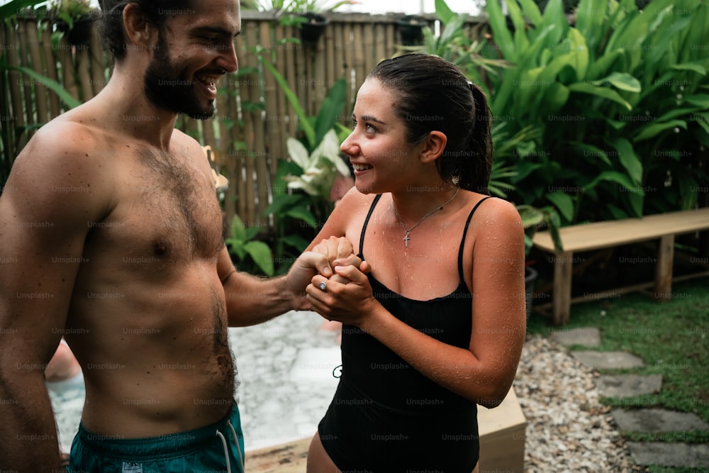 a man and a woman standing next to each other