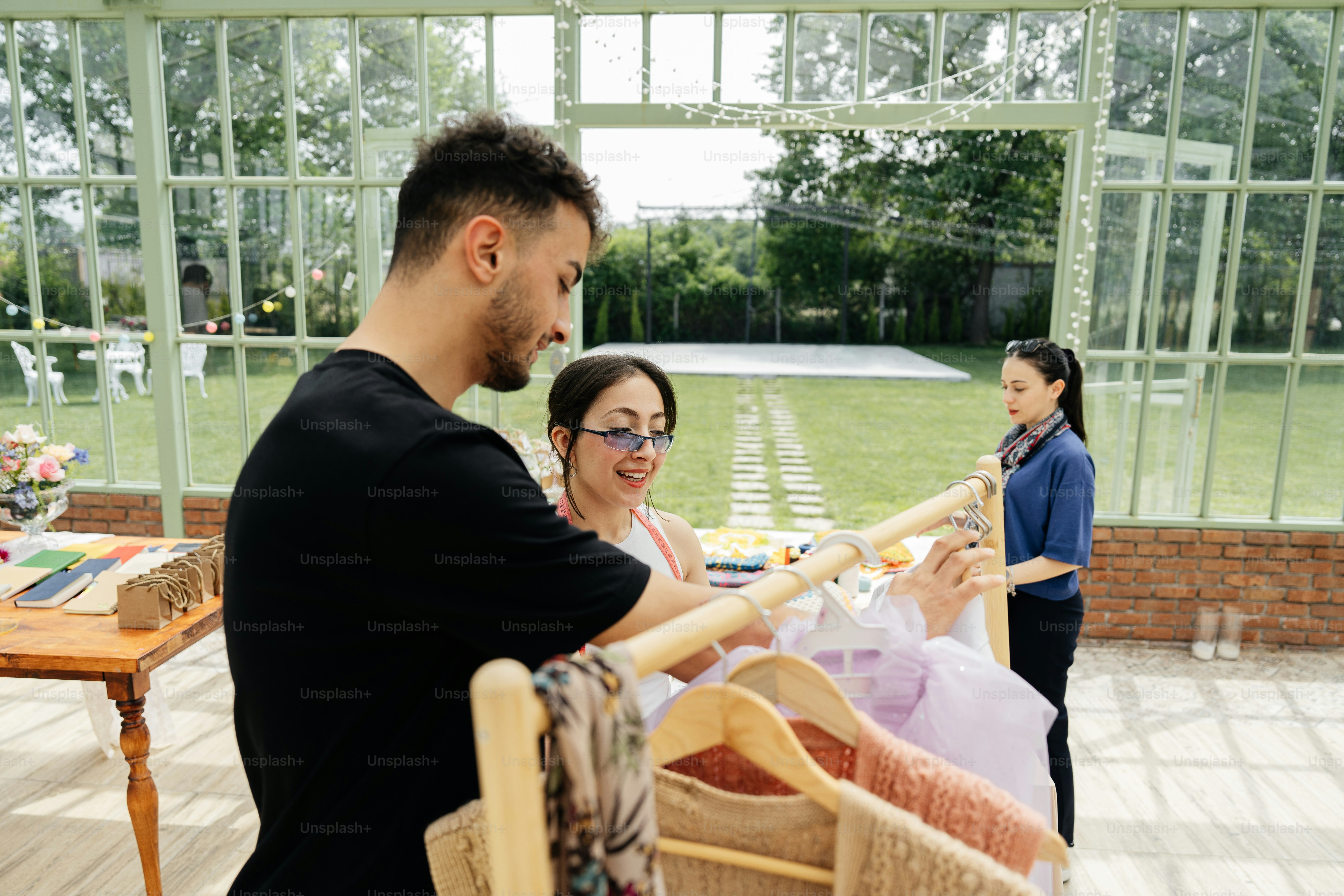 a man holding a baby in a stroller