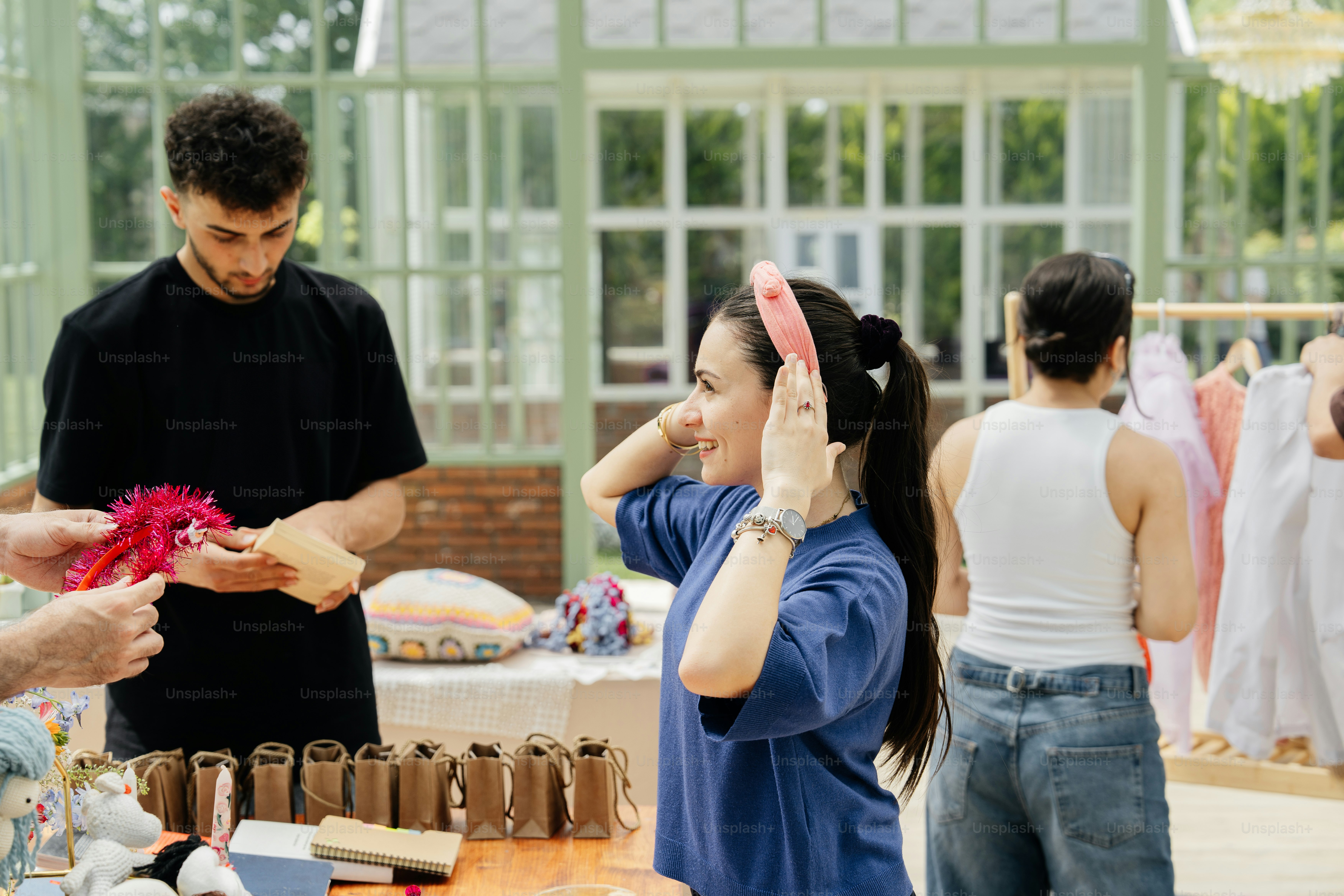 a group of people standing around a table