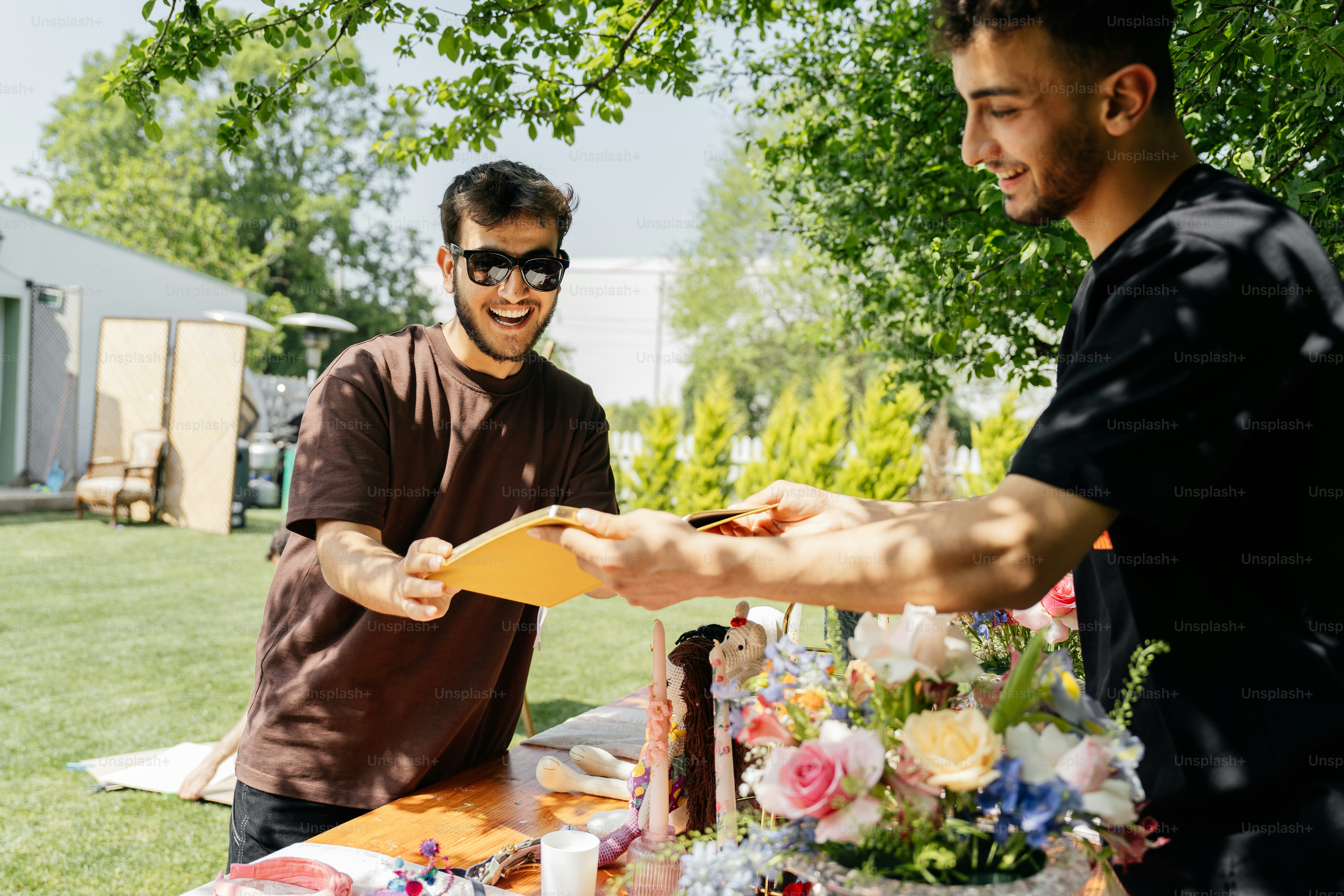 a man handing a piece of paper to another man