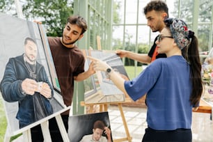 a man and a woman painting a picture of a man