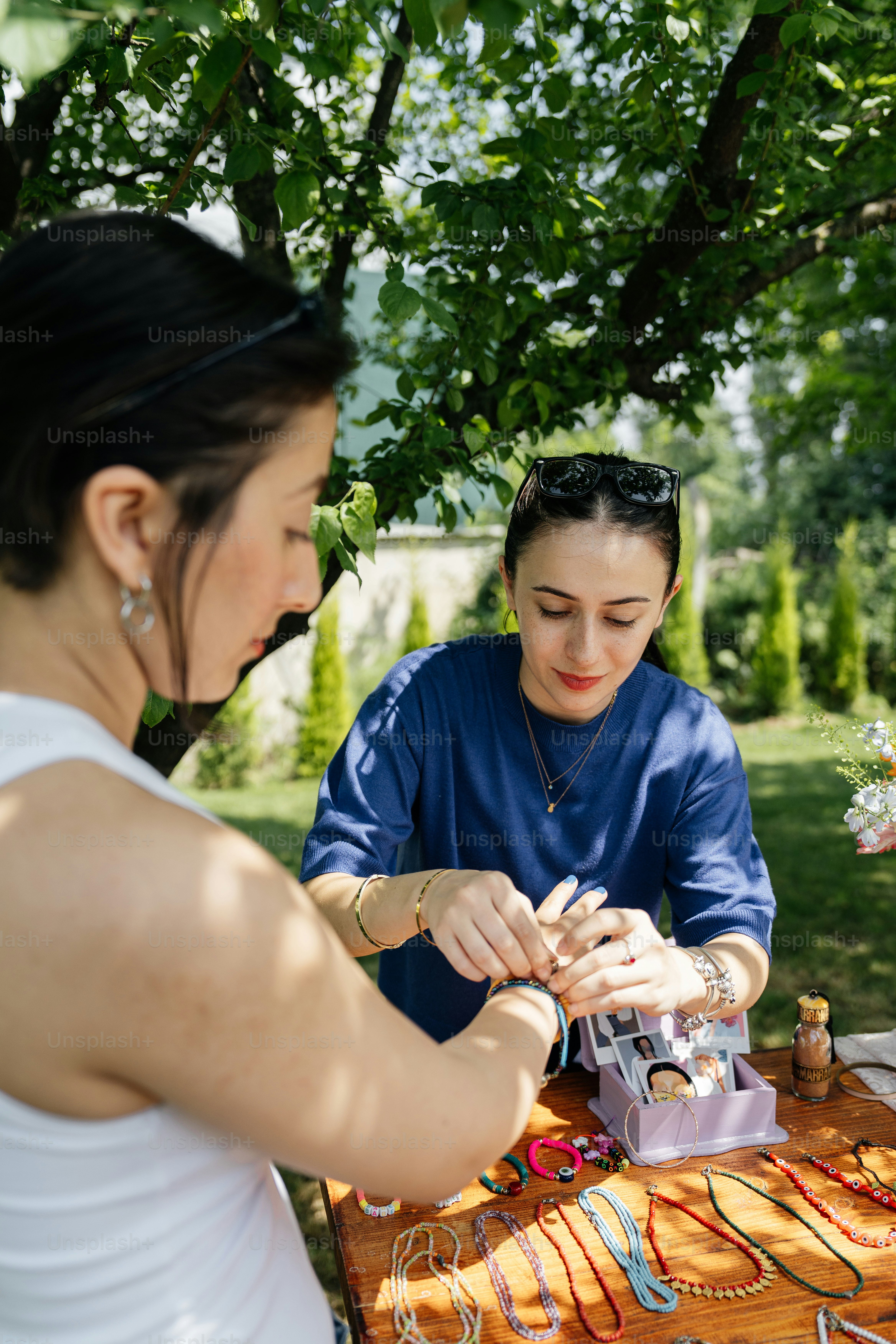 a couple of women sitting at a table