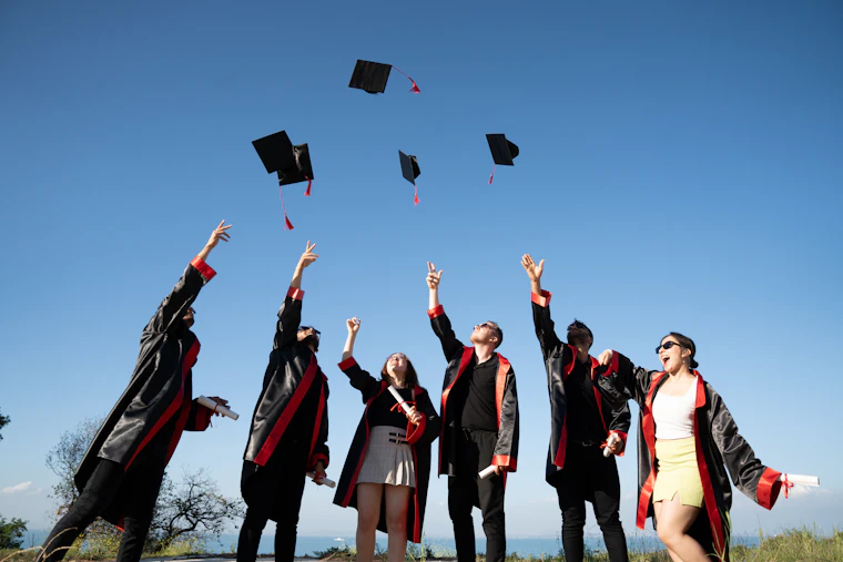 Graduates celebrating admissions success at a college