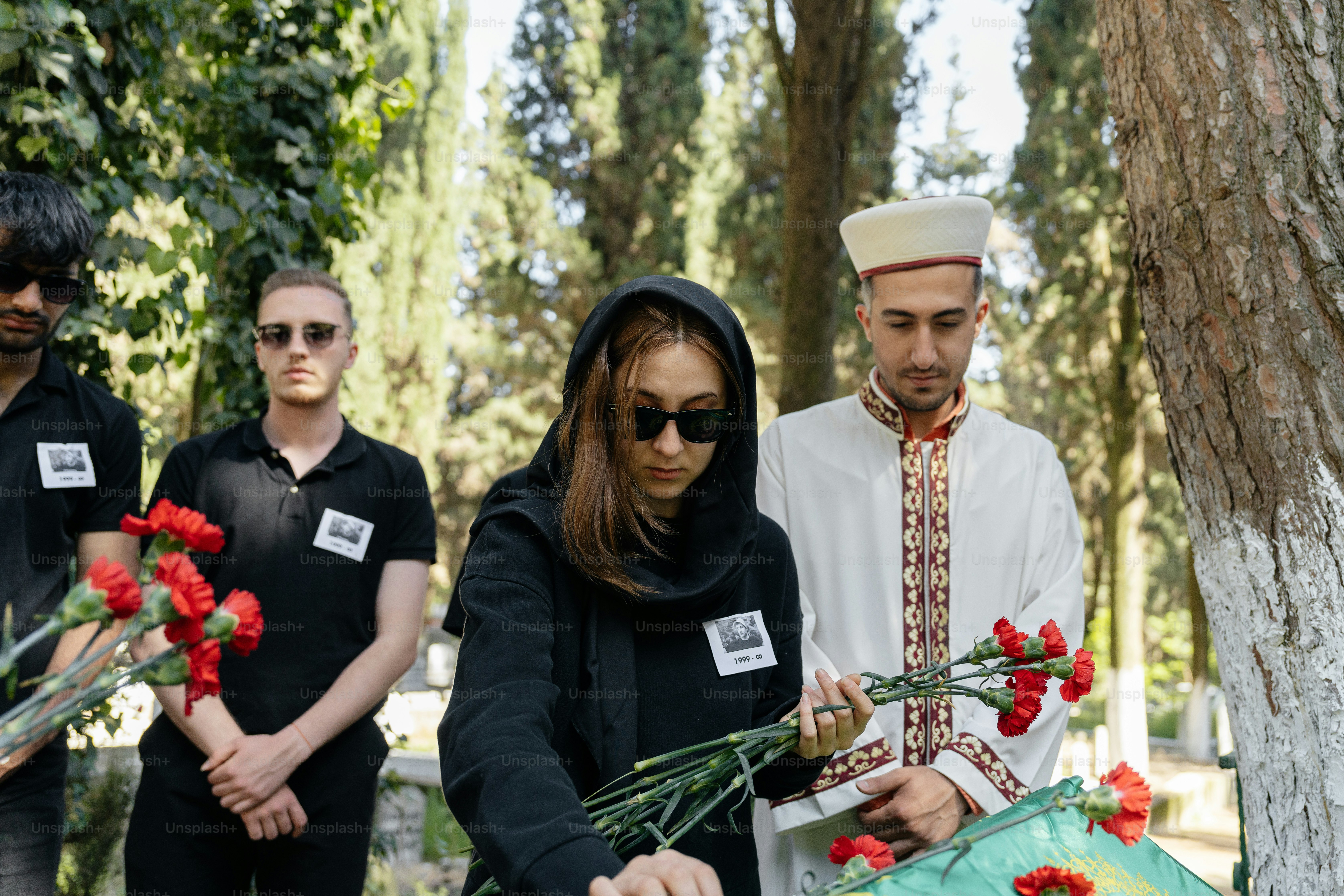 a group of people standing around a tree