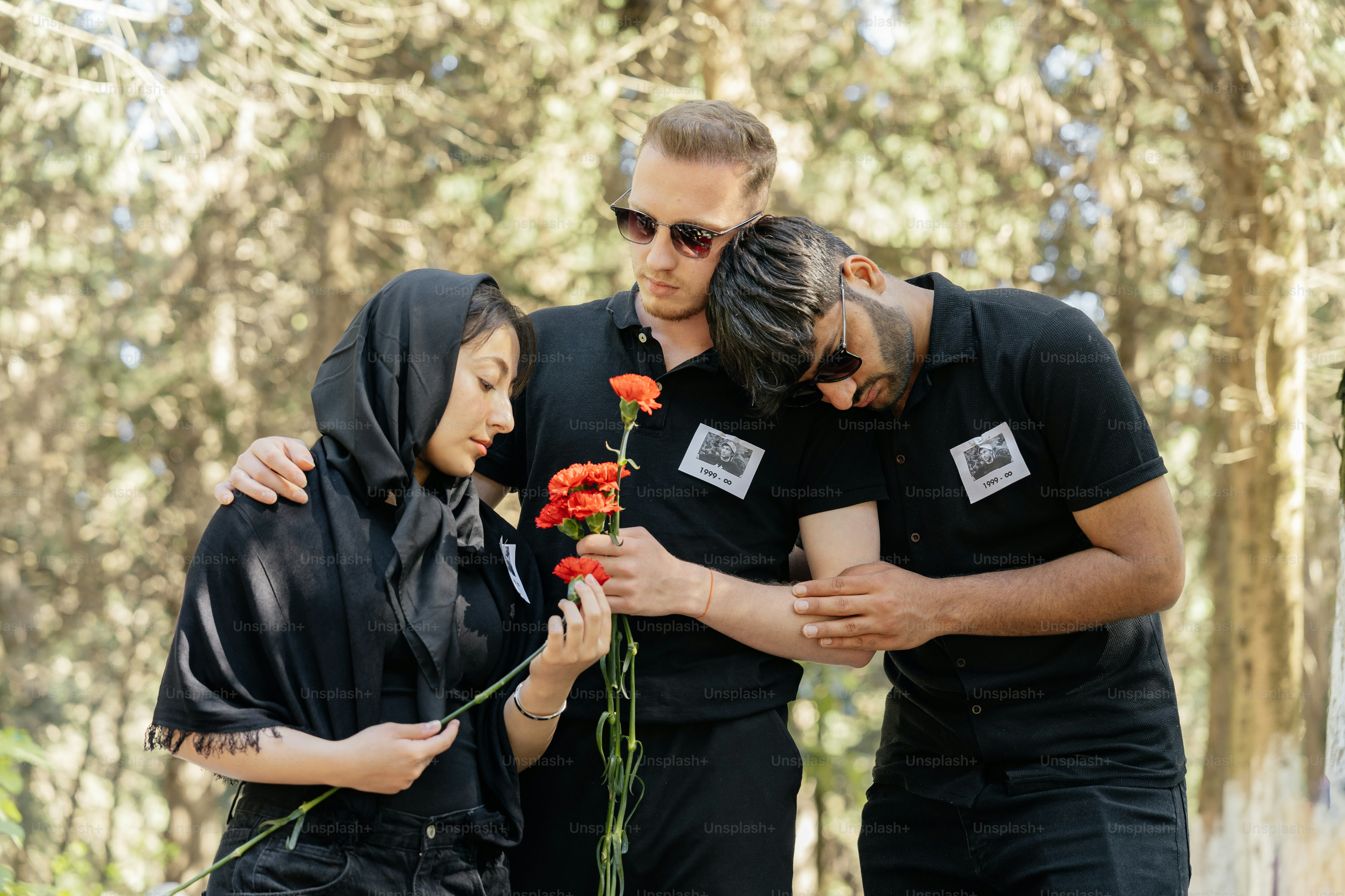 a group of people standing around each other