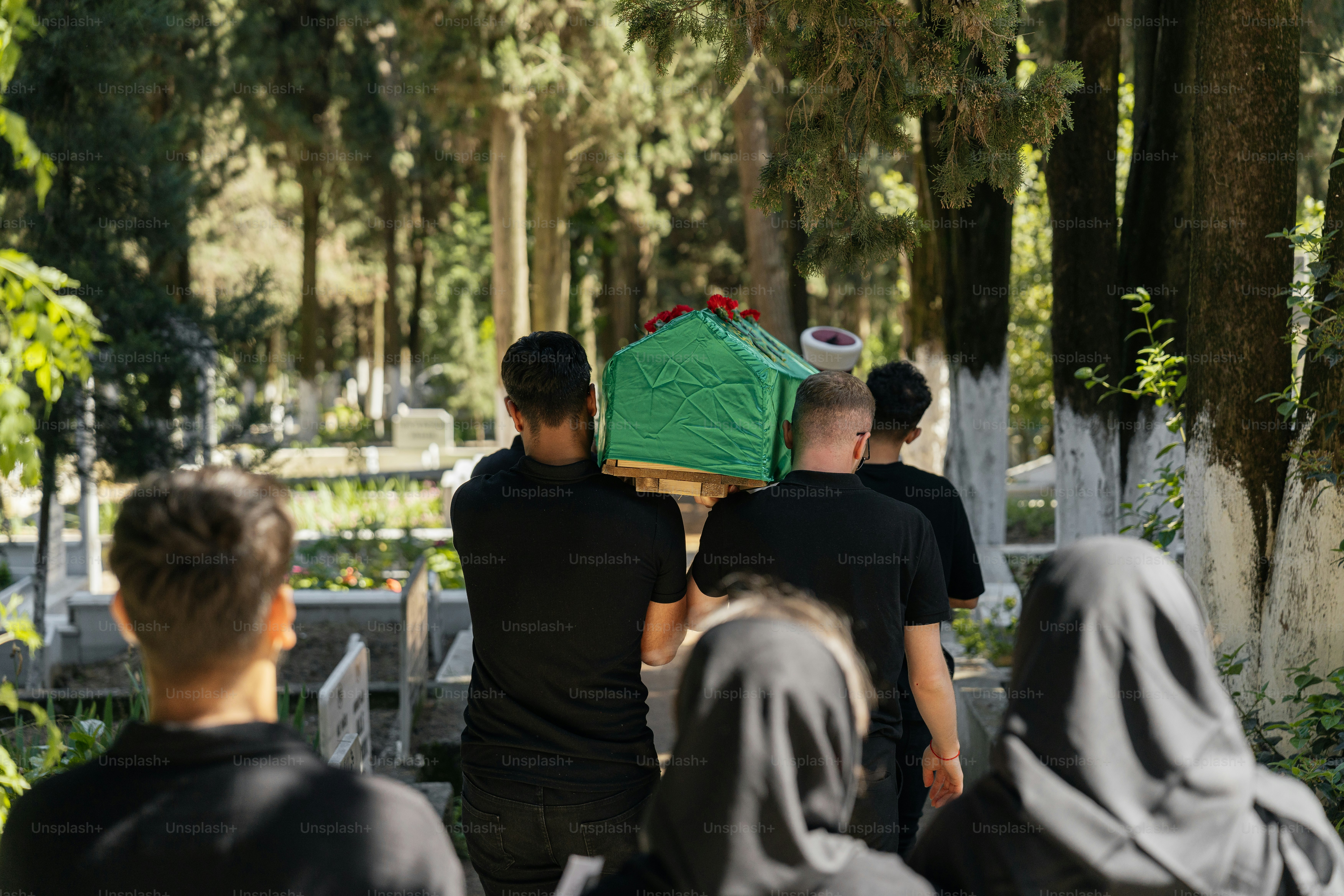 a group of people carrying a green object