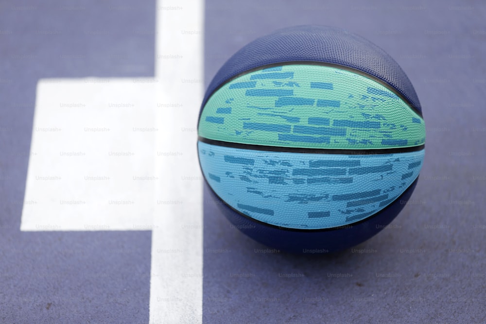 a close up of a basketball on a court