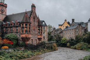 a river running through a city next to tall buildings