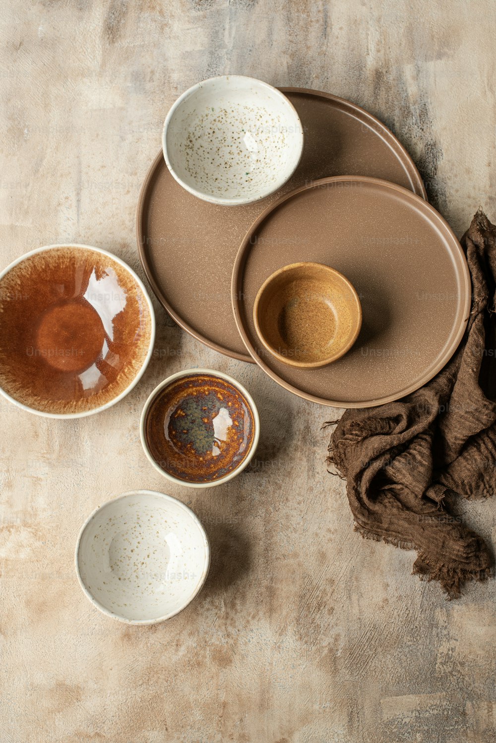 a table topped with three bowls and a plate