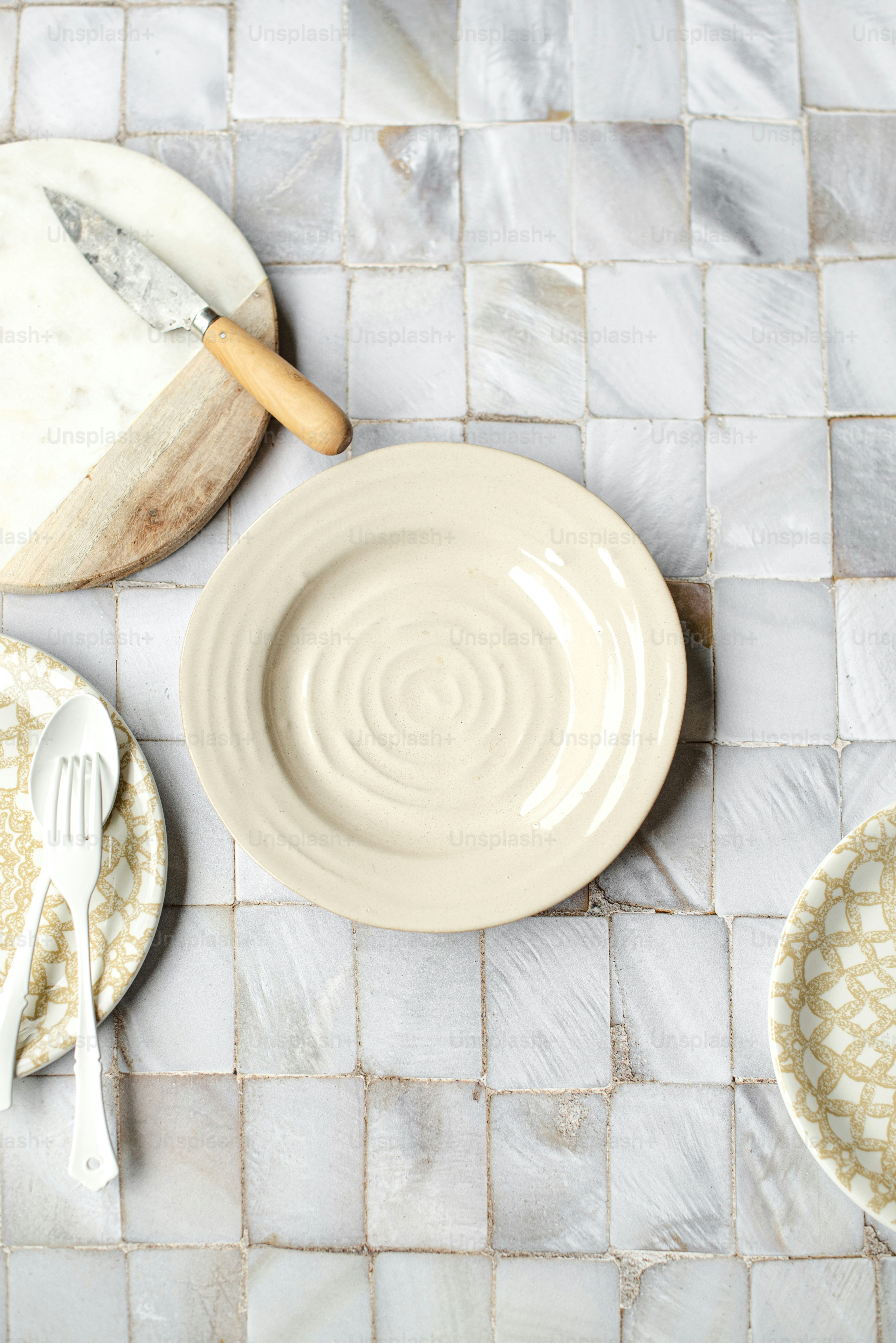a table topped with plates and a knife and fork