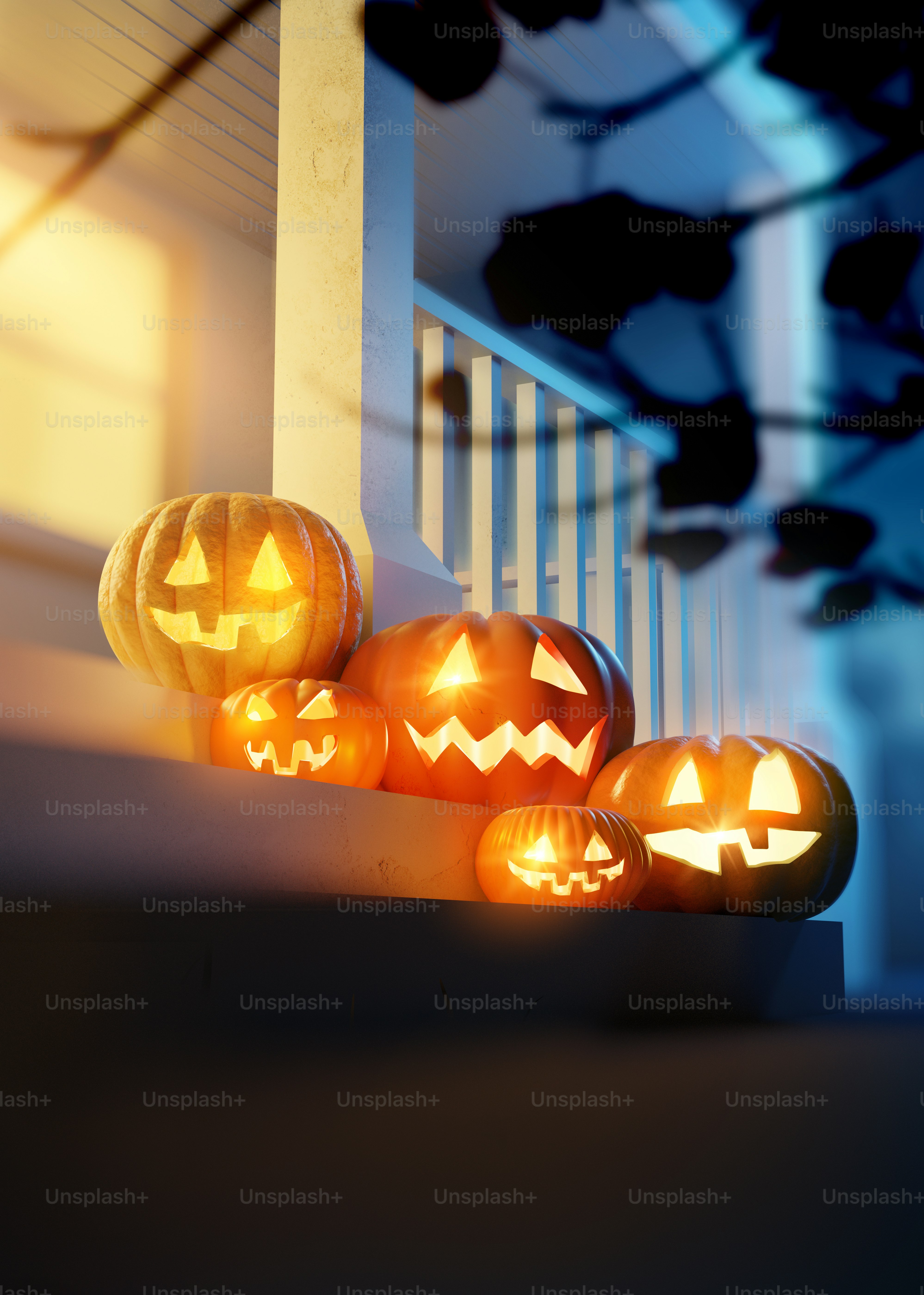 Halloween Pumpkin Jack O' Lanterns lighting up a decorated front porch ...
