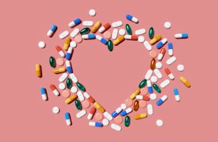 Medicine pills and capsules in a heart shape. 3D render illustration.